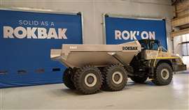 A Rokbak RA40 articulated dump truck stands in front of the Motherwell facility's new fast-acting doors