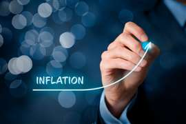 Graphic showing inflation rising as a hand draws an upward curve